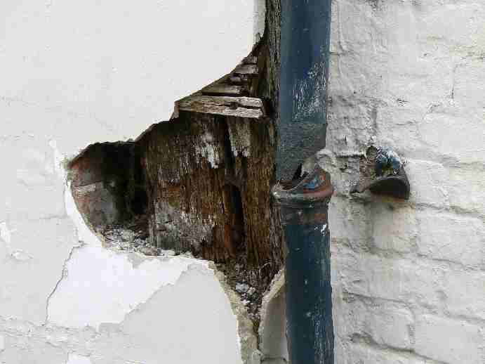 Image of a rotten timber frame.